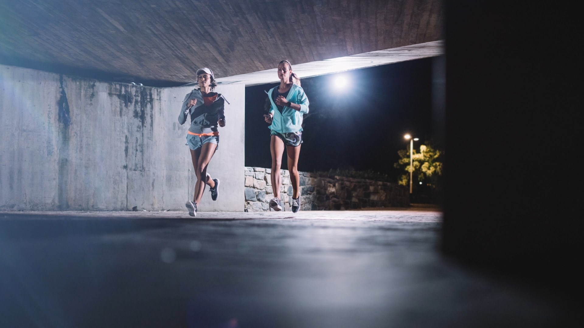 two women jogging at night